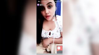 Horny girl pressing big boobs and fingering wet pussy