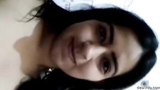 Sexy girl pressing her big boobs and fingering hairy pussy